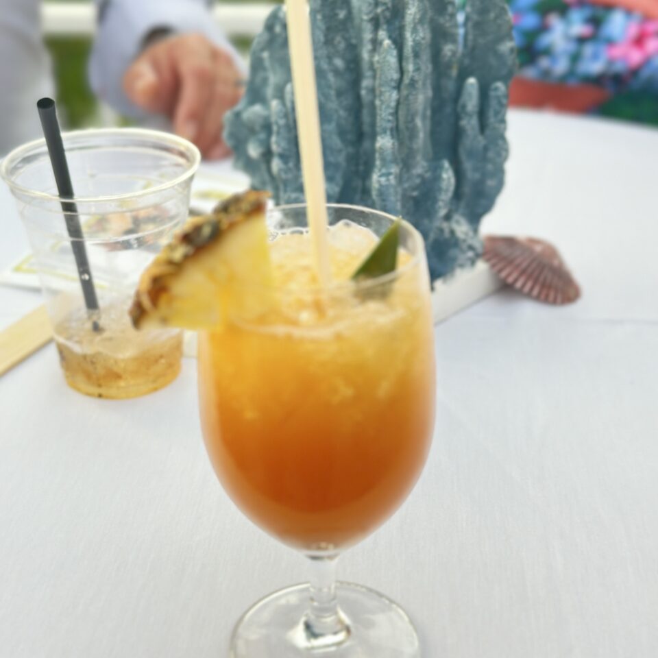 Tropical cocktail garnished with a pineapple wedge