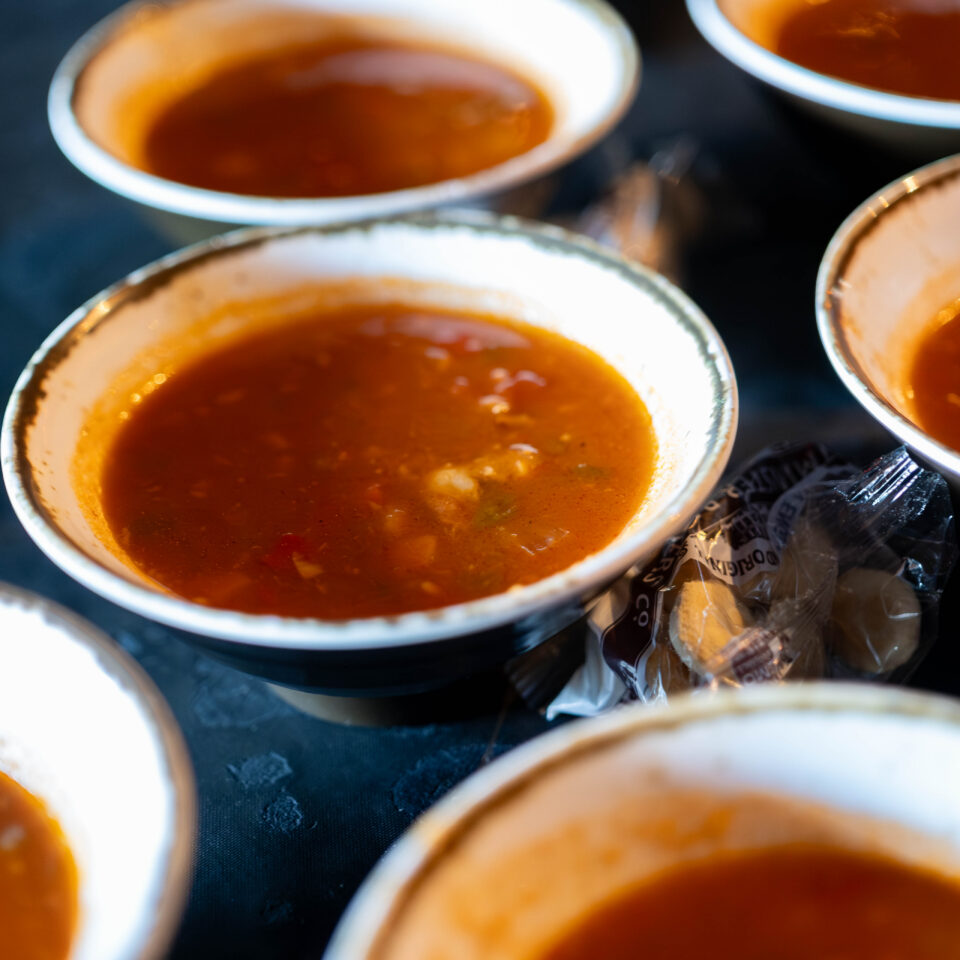 Rows of small bowls of tomato bisque
