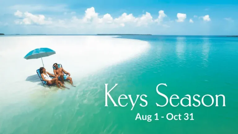 Keys Season, August 1 to October 31: couple relaxing on a sandbar (opens in a new tab)
